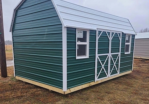 Green door with white trim Shed