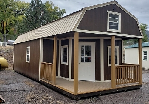  Outside view of brown and white tiny house.