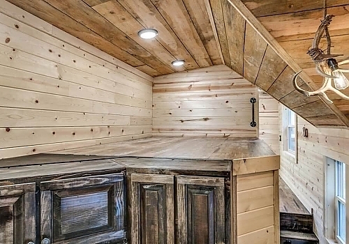  Wood shelves in tiny house.