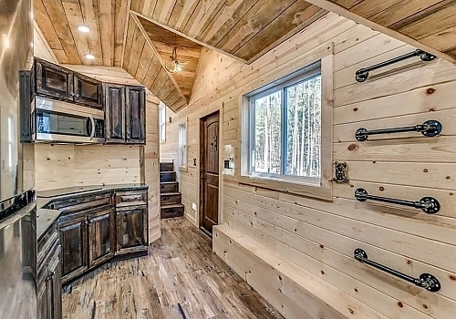  Wood wall view of kitchen in tiny house | Haskell, OK