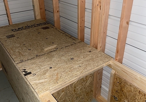 Inside view of a metal kennel.