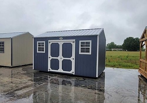 Gray double-door shed with white trim.
