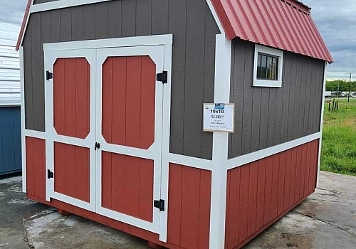 red and brown double-door shed with white trim | Beland, OK