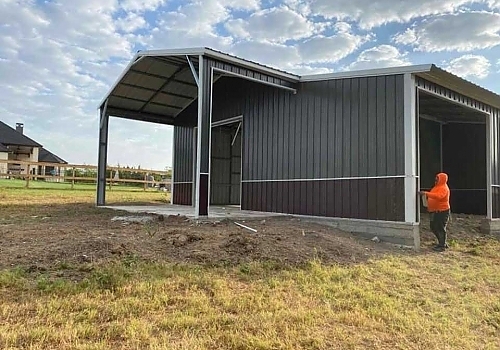 Person standing next to side view of gray & burgundy combo unit