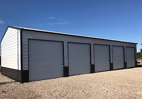 Multi vehicle, multi bay, brown and white garage.