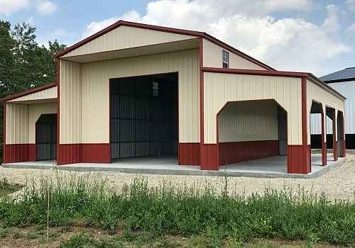 Red and cream colored pre-engineered metal building in Okay, Oklahoma.