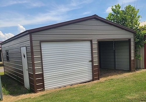 Brown and cream metal storage shed in Tullahassee, OK